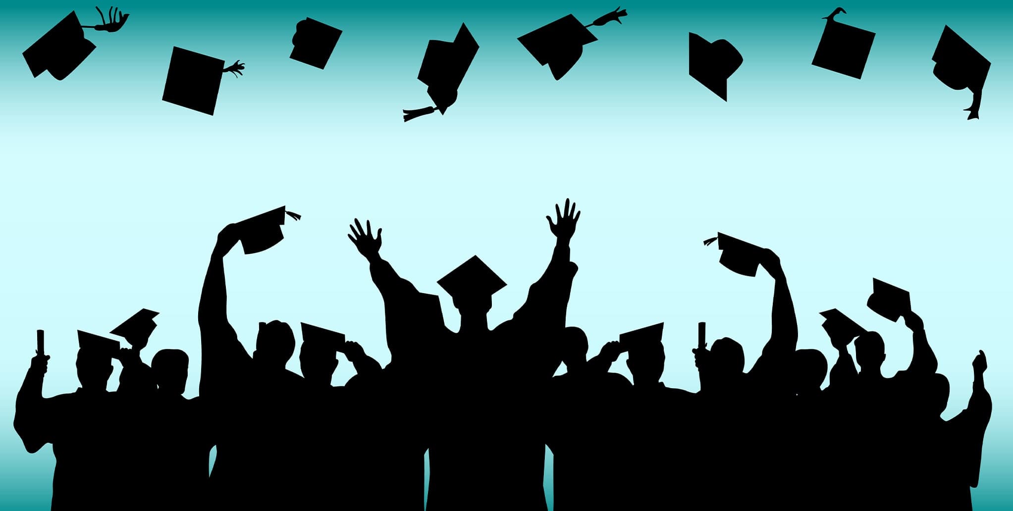 Graduating students throwing caps in the air
