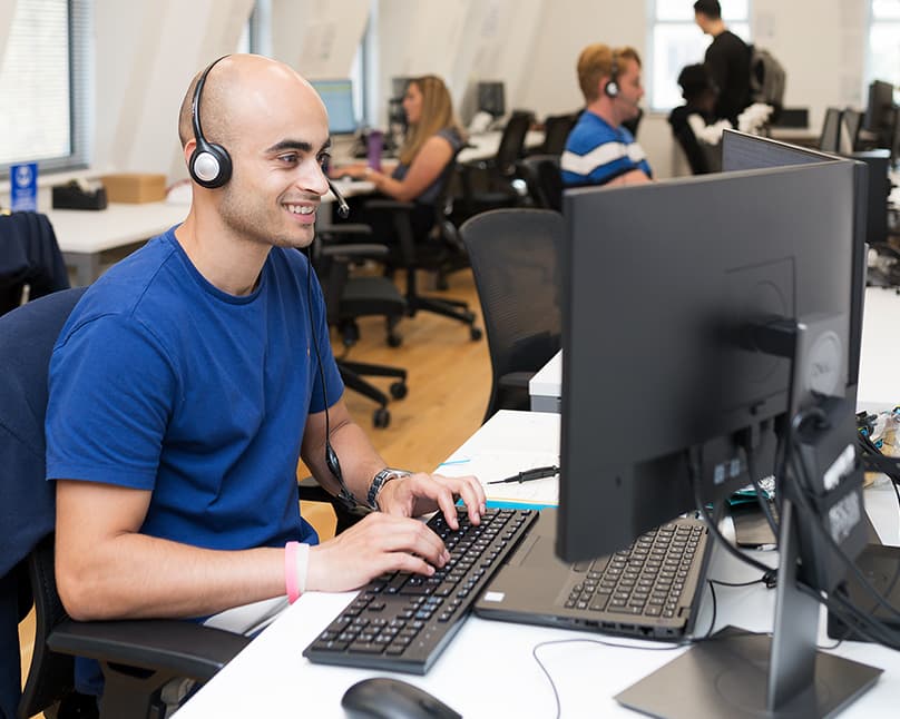 Customer Formation Executive, Othello on the phone to clients of QCF.